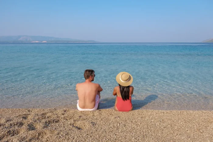 couple relaxing by the water on Krk island