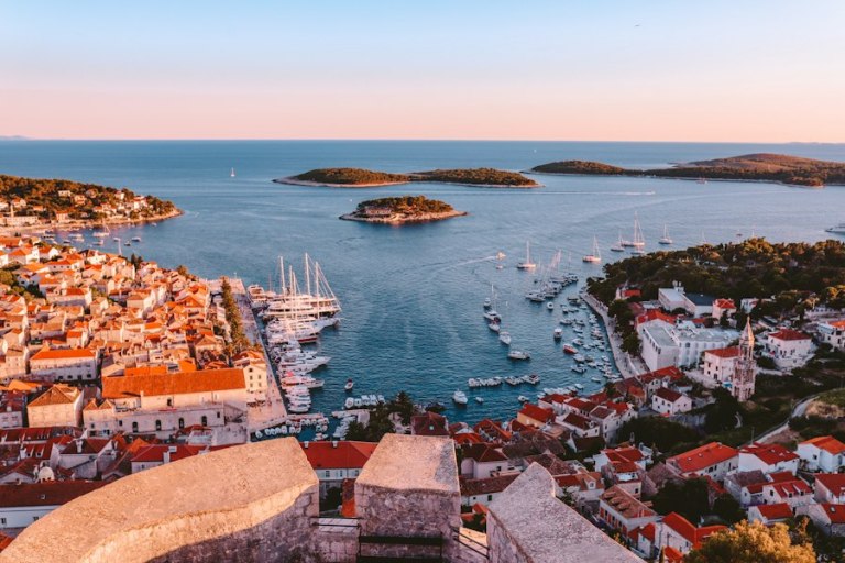 Hvar town rooftops and harbour with the Pakleni islands on the horizon